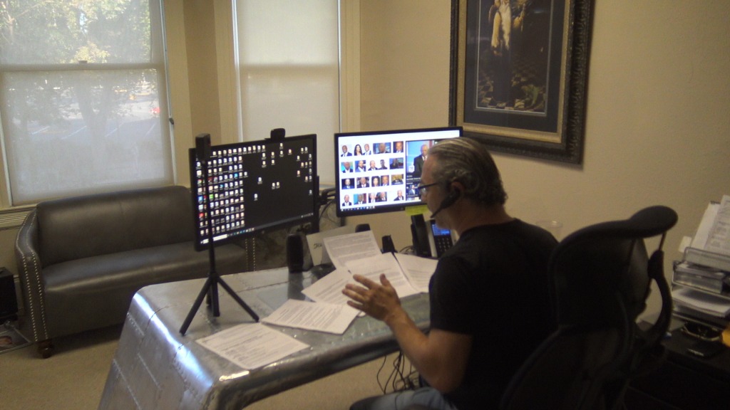 Jack Whatley at multi-monitor operations desk